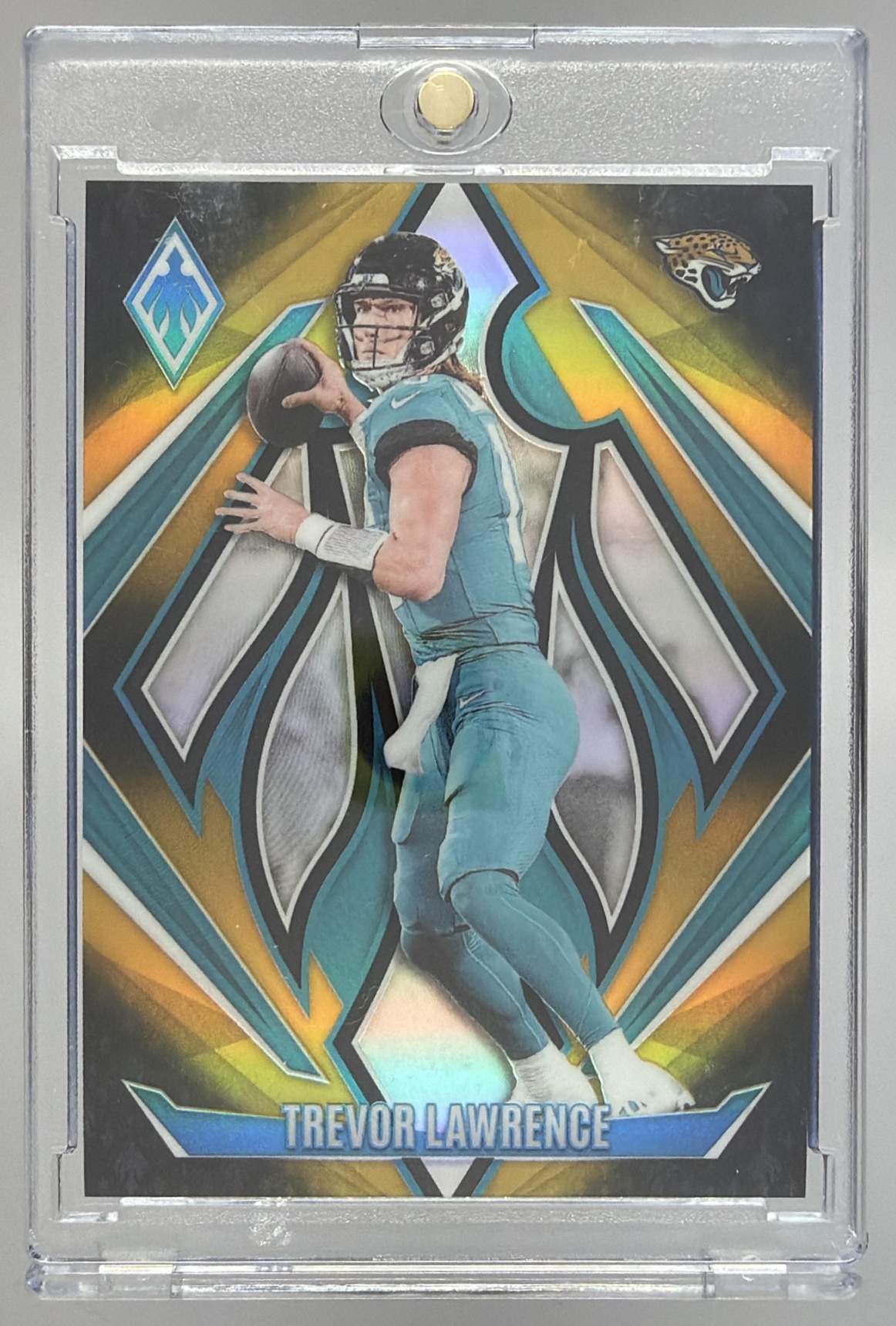 Card image for 2024 Panini Phoenix Trevor Lawrence Gold Fade /125 #137 Jaguars