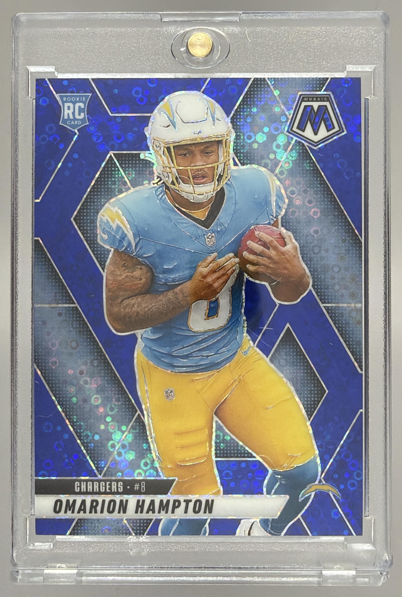 Card image for 2025 Panini Mosaic Omarion Hampton Rookies No Huddle Blue Prizm /99 #335 RC Chargers