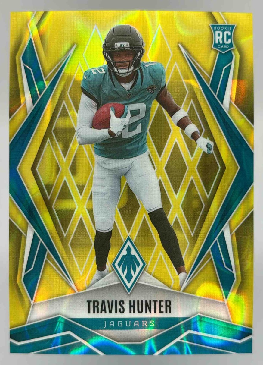 Card image for 2025 Panini Phoenix Travis Hunter Bronze Pandora /125 #157 RC Jaguars