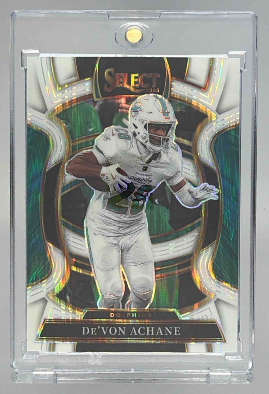 Card image for 2025 Panini Select De'Von Achane Concourse White Prizm Shock /799 #81 Dolphins