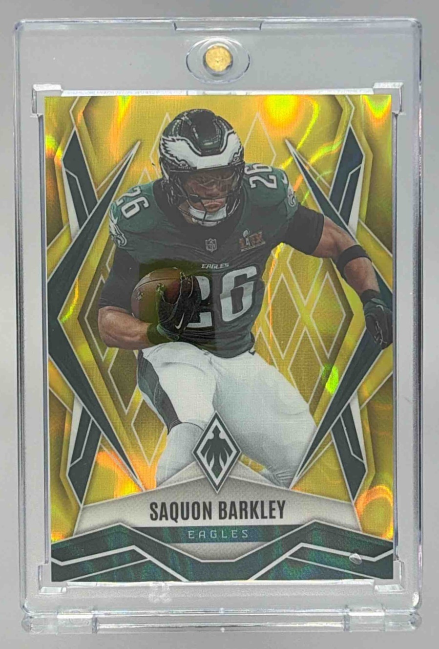 Card image for 2025 Panini Phoenix Saquon Barkley Yellow Lava /125 #77 Eagles