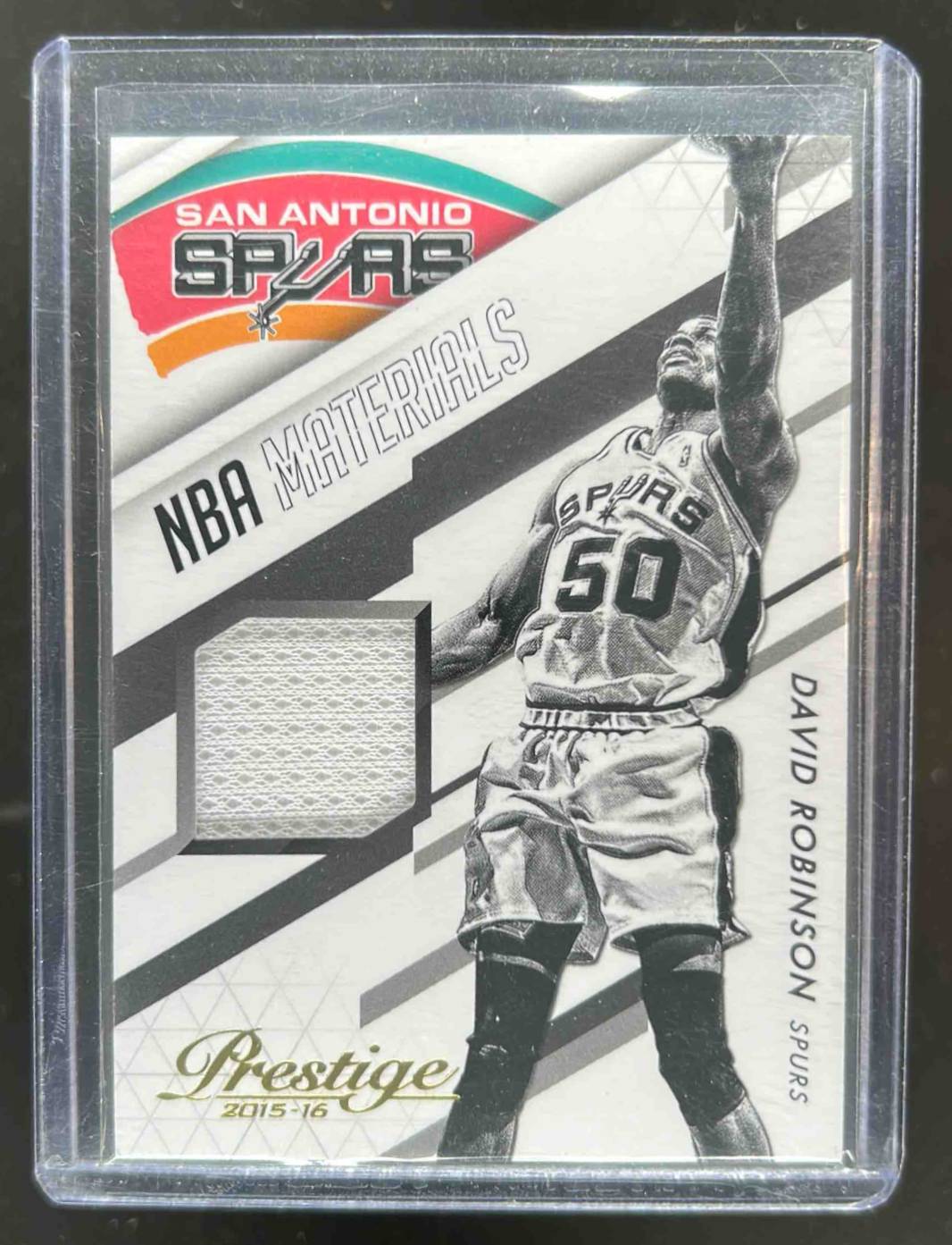 Card image for 2015-16 PANINI PRESTIGE DAVID ROBINSON NBA MATERIALS #NBM-DR SAN ANTONIO SPURS