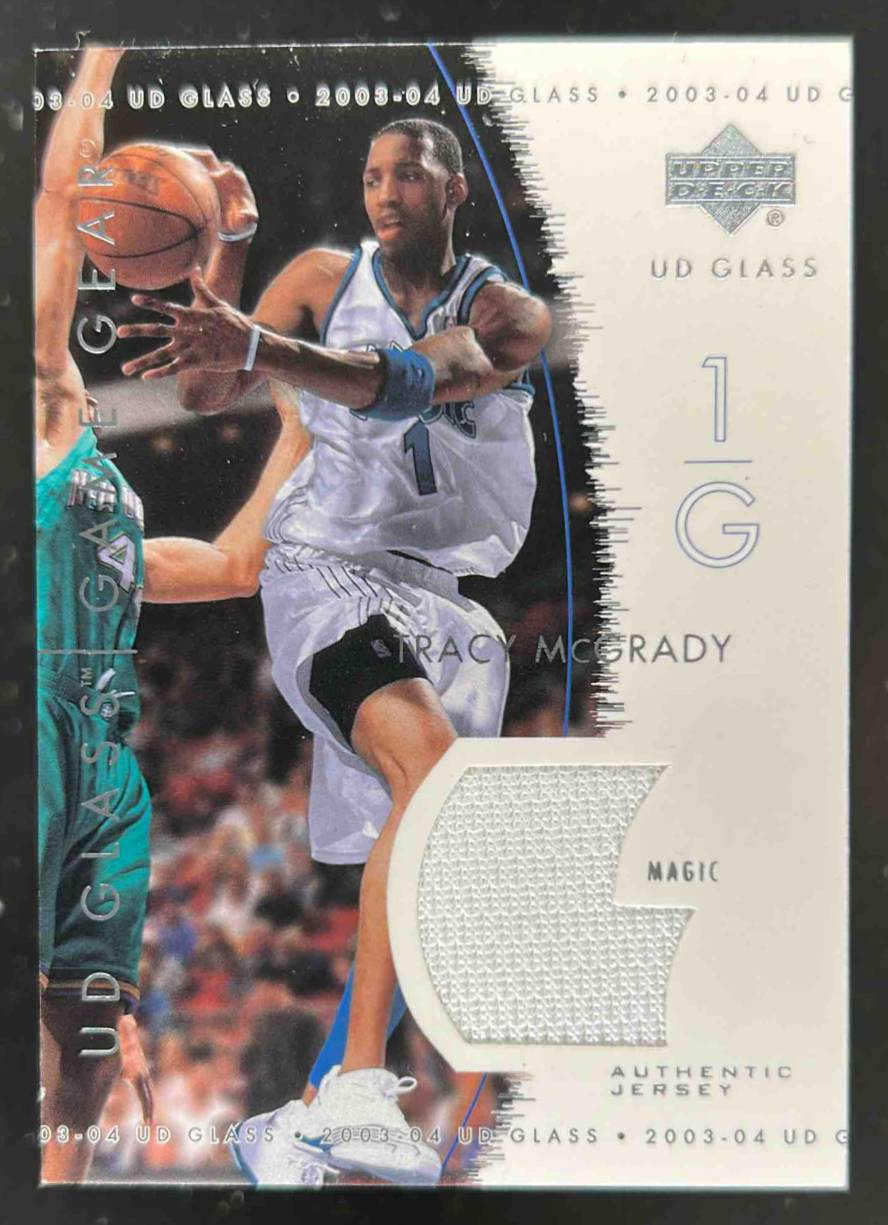 Card image for 2003-04 UPPER DECK GLASS TRACY MCGRADY GAME GEAR #GG-TM MEM ORLANDO MAGIC