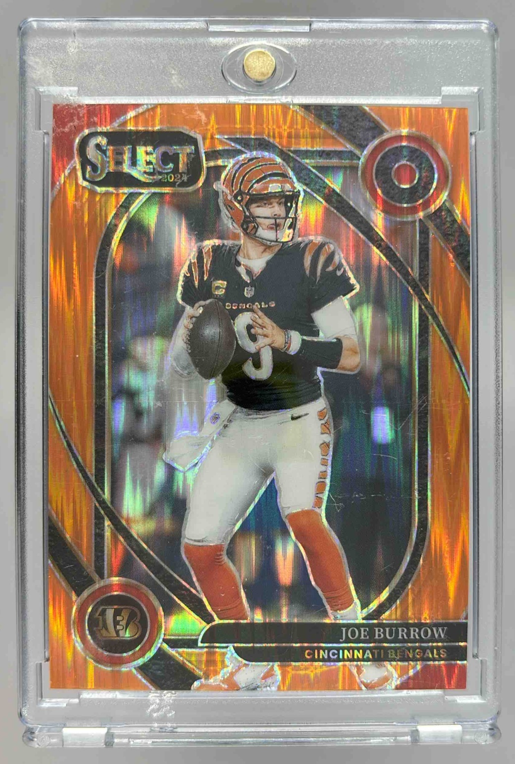 Card image for 2024 Panini Select Joe Burrow Premier Orange Prizm Shock /399 #127 Bengals