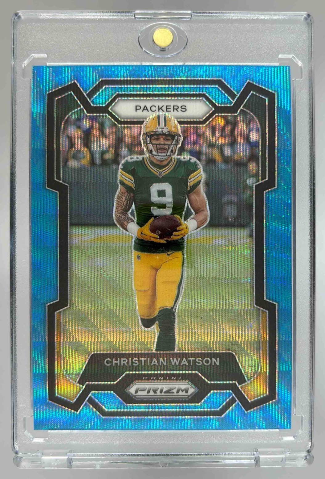 Card image for 2023 Panini Prizm Christian Watson Blue Wave /199 #107 Packers