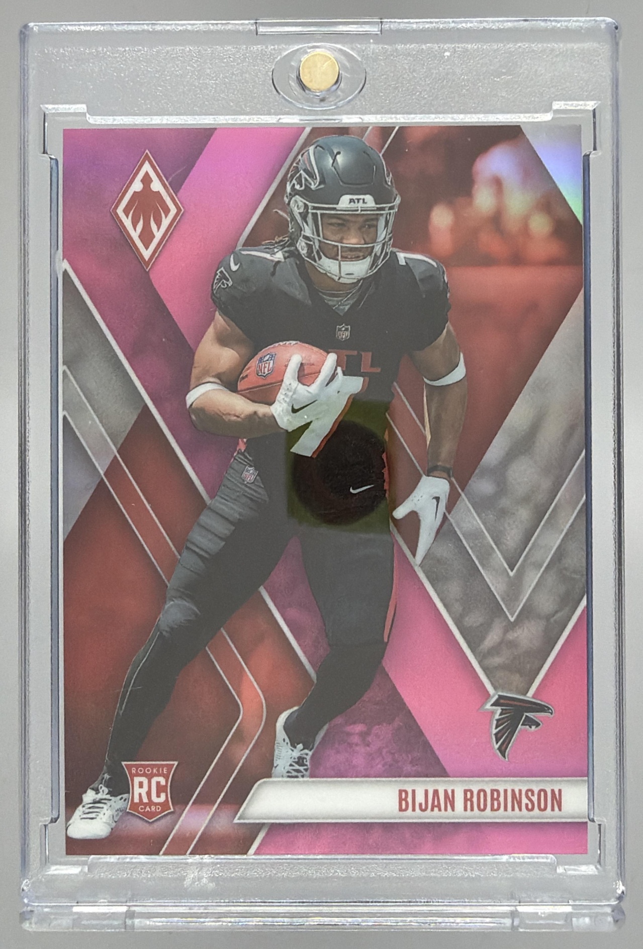 Card image for 2023 Panini Football Phoenix Bijan Robinson Pink /199 #104 RC Atlanta Falcons