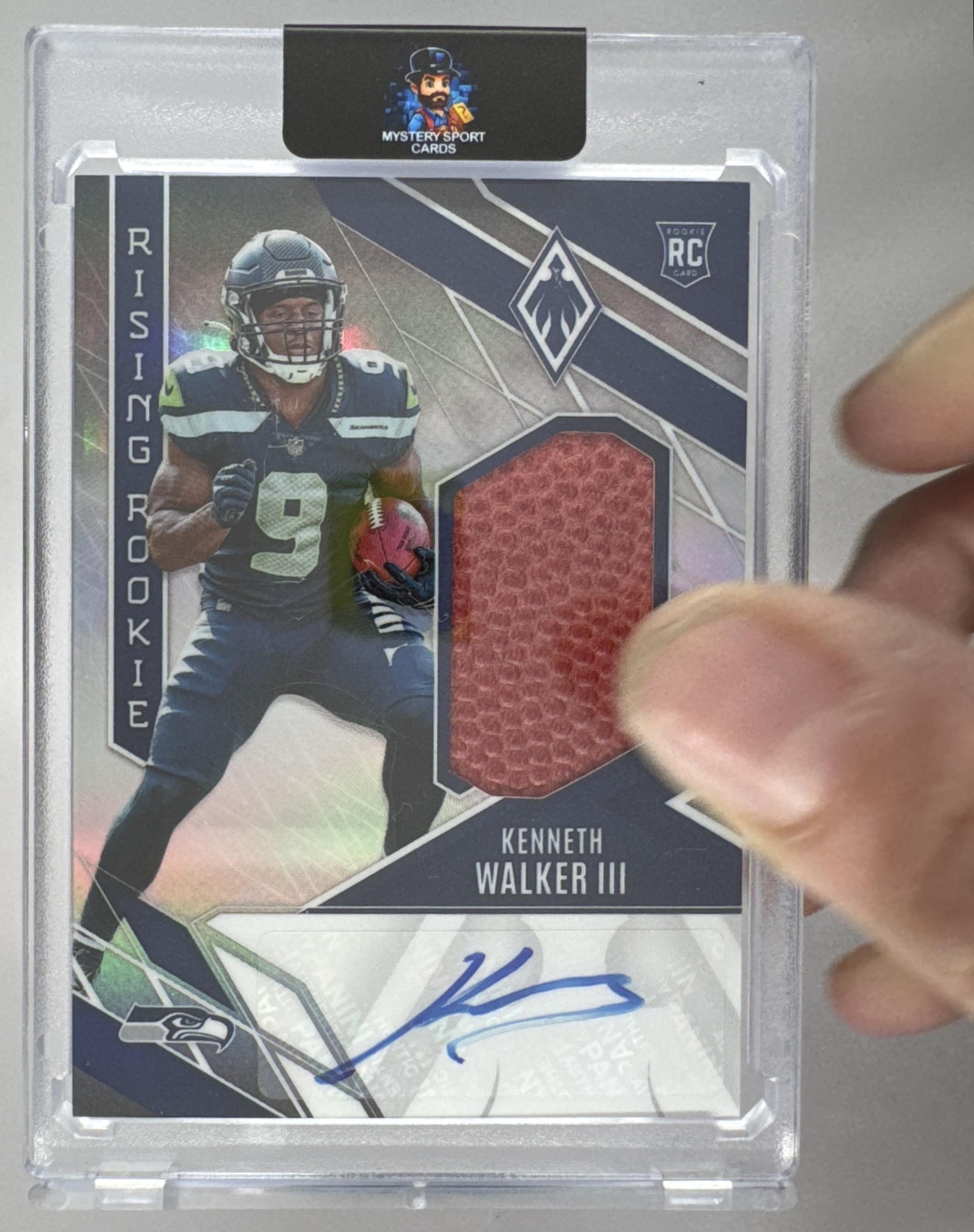 Card image for 2022 Panini Phoenix Kenneth Walker III Rising Rookie Material Signature Football /149 #RMS-KW RC Auto Seahawks