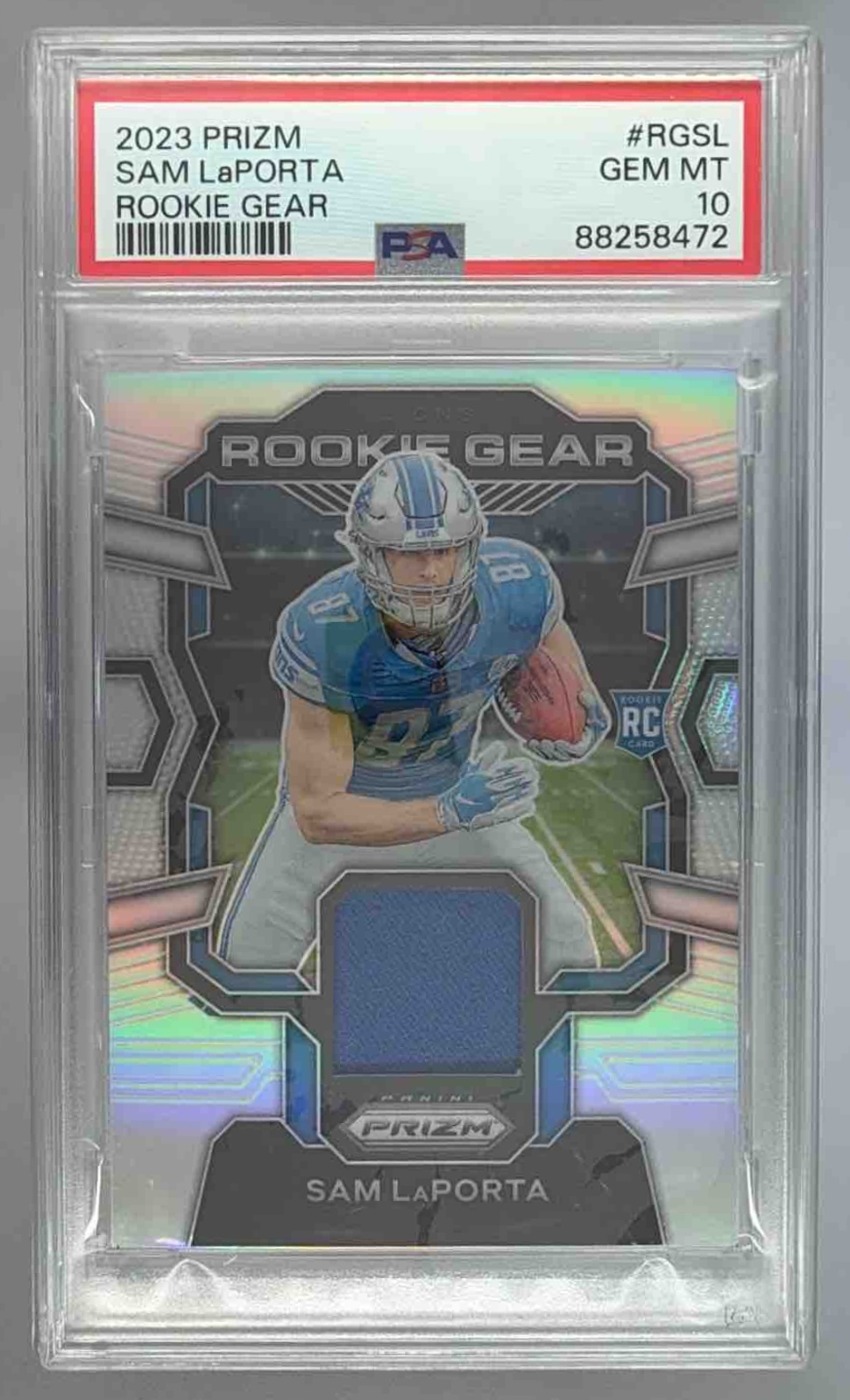 Card image for 2023 Panini Prizm Sam LaPorta Rookie Gear Purple Pulsar #RG-SL MEM RC Lions