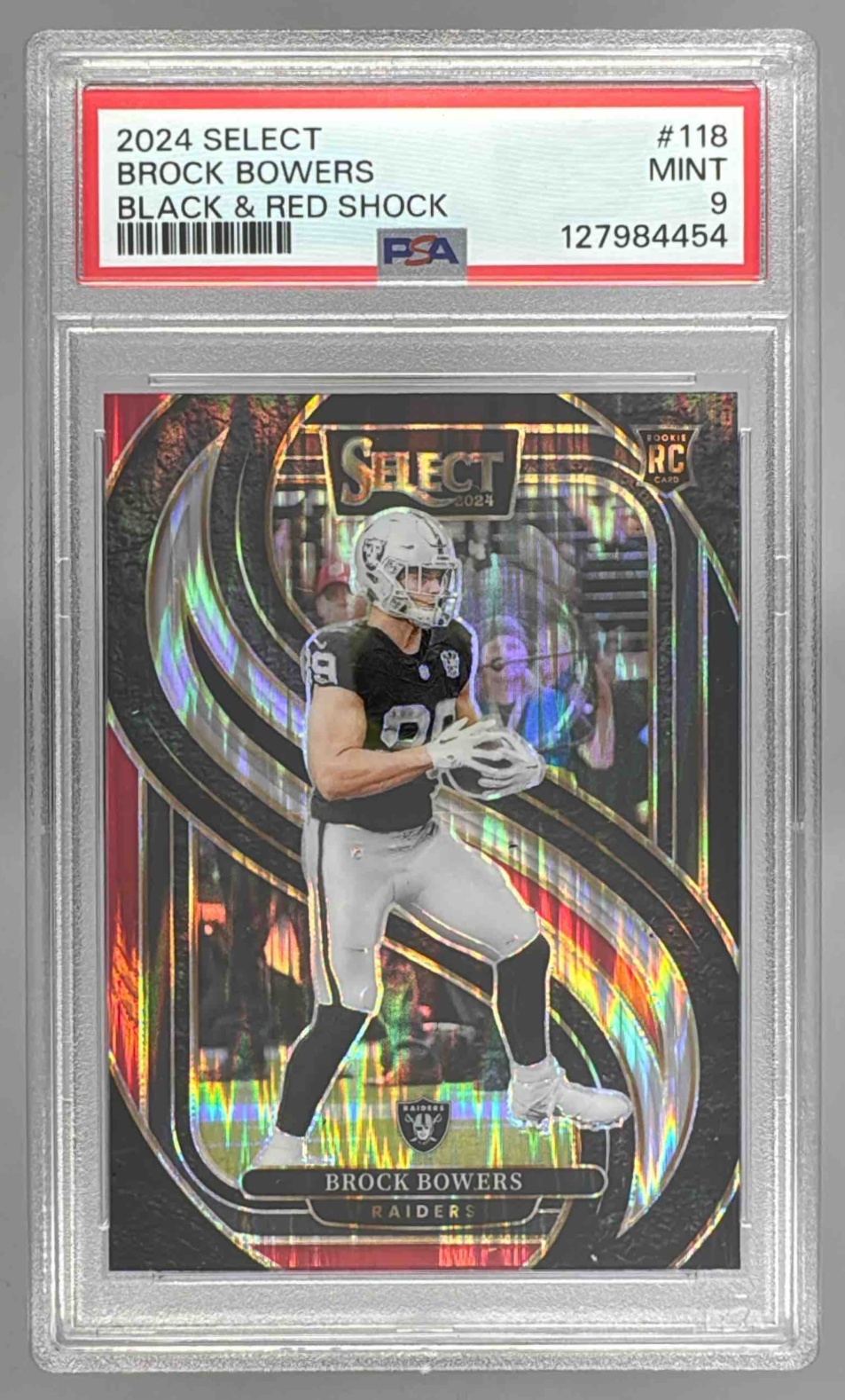 Card image for 2024 Panini Select Brock Bowers Premier Black and Red Prizm Shock #118 RC Raiders