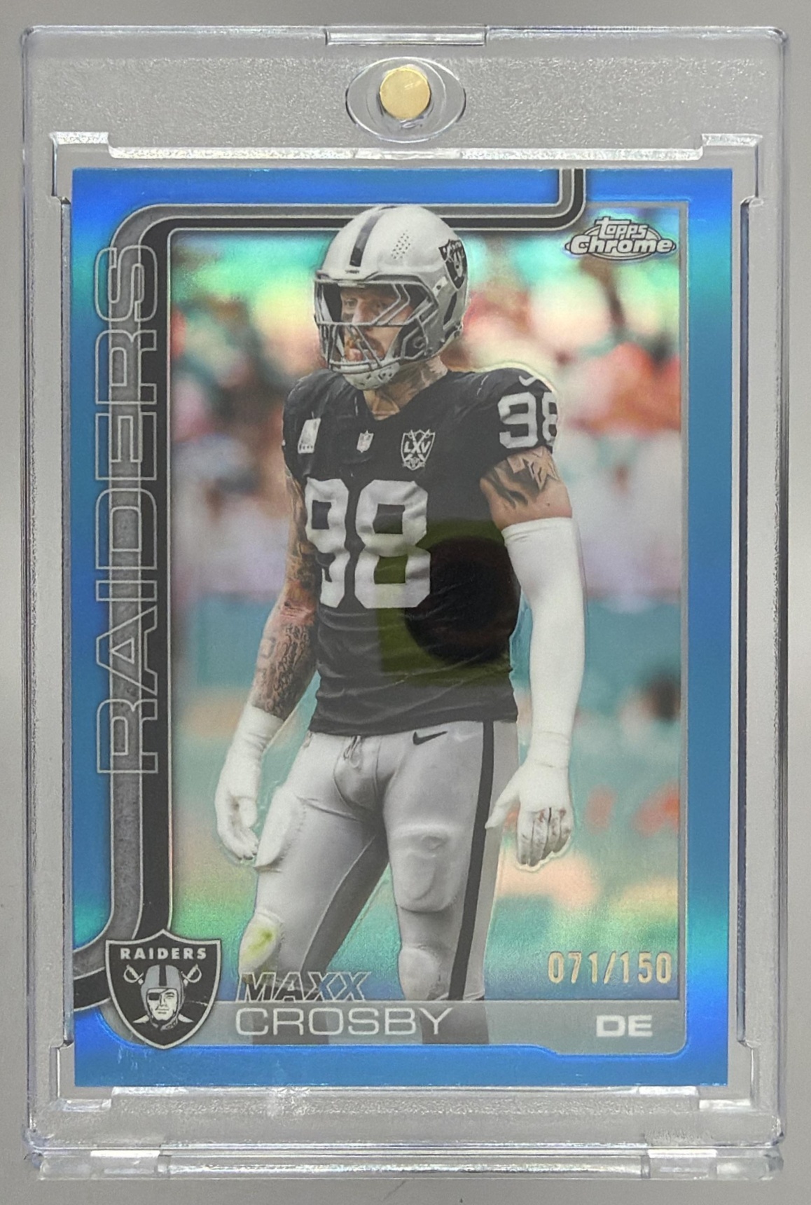 Card image for 2025 Topps Chrome Maxx Crosby Blue Refractor /150 #180 Raiders