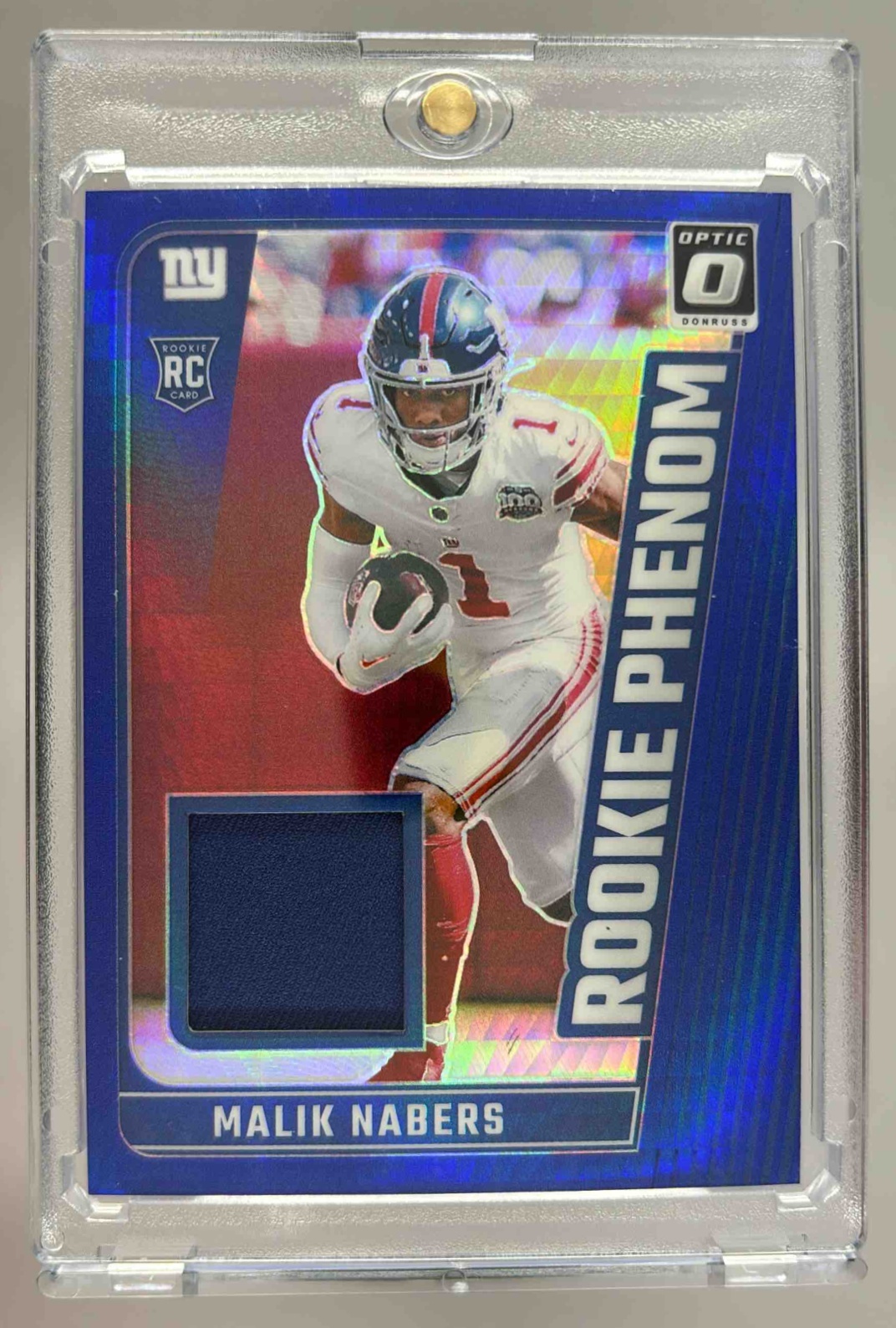 Card image for 2024 Panini Donruss Optic Malik Nabers Rookie Phenoms Blue Hyper #RPB-MNS MEM RC Giants