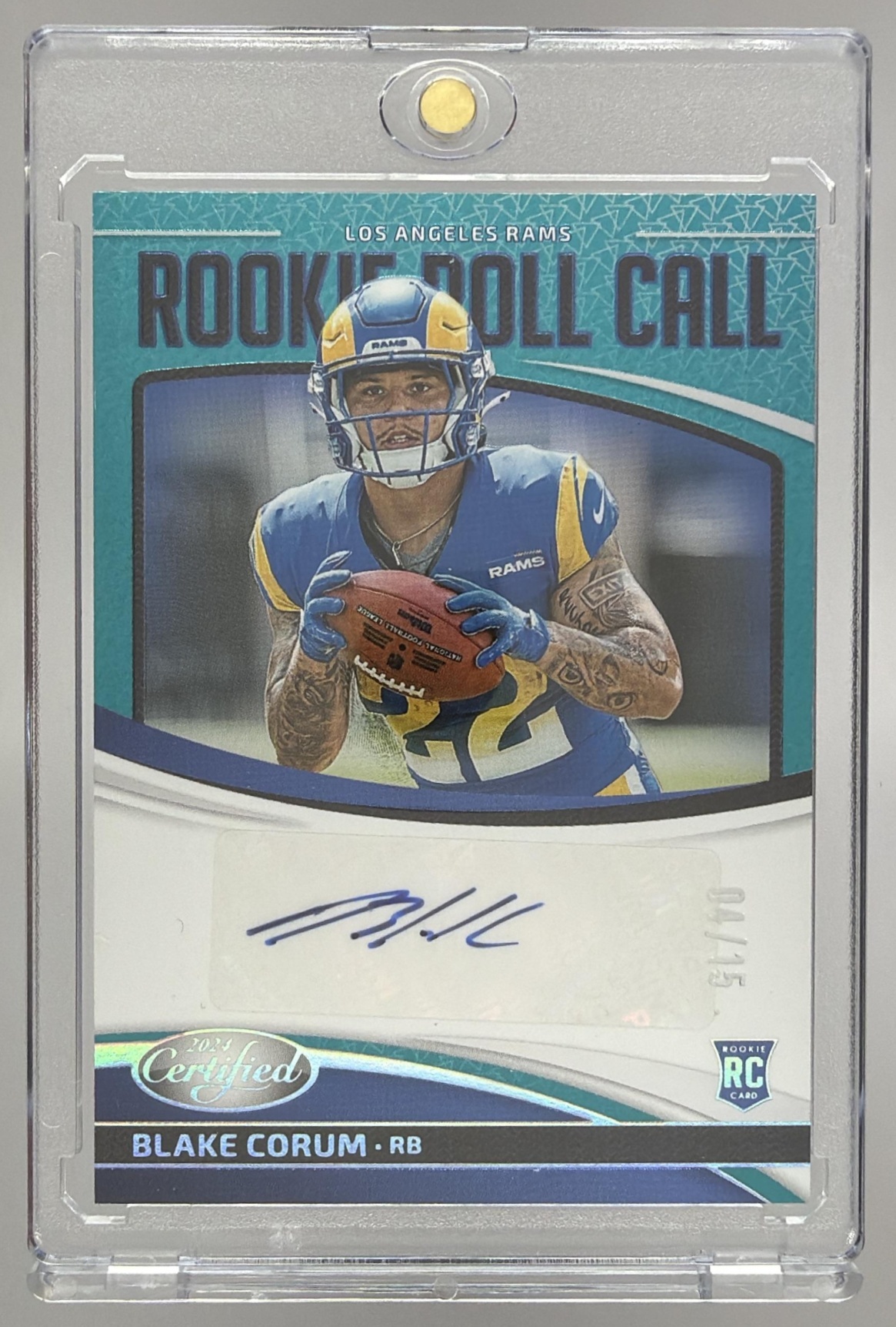 Card image for 2024 Panini Certified Blake Corum Rookie Roll Call Signatures Teal Etch /15 #RRC-BCM RC Auto Rams