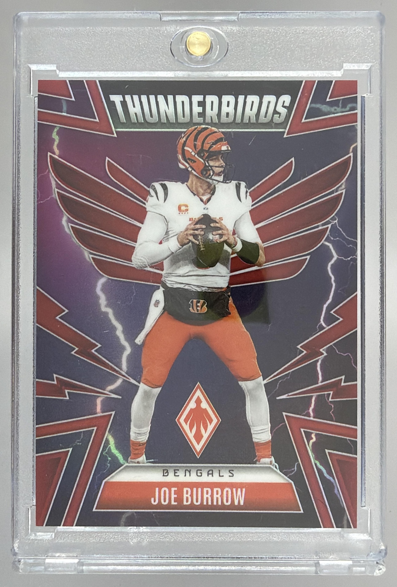 Card image for 2025 Panini Phoenix Joe Burrow Thunderbirds Red Prizm /249 #10 Bengals