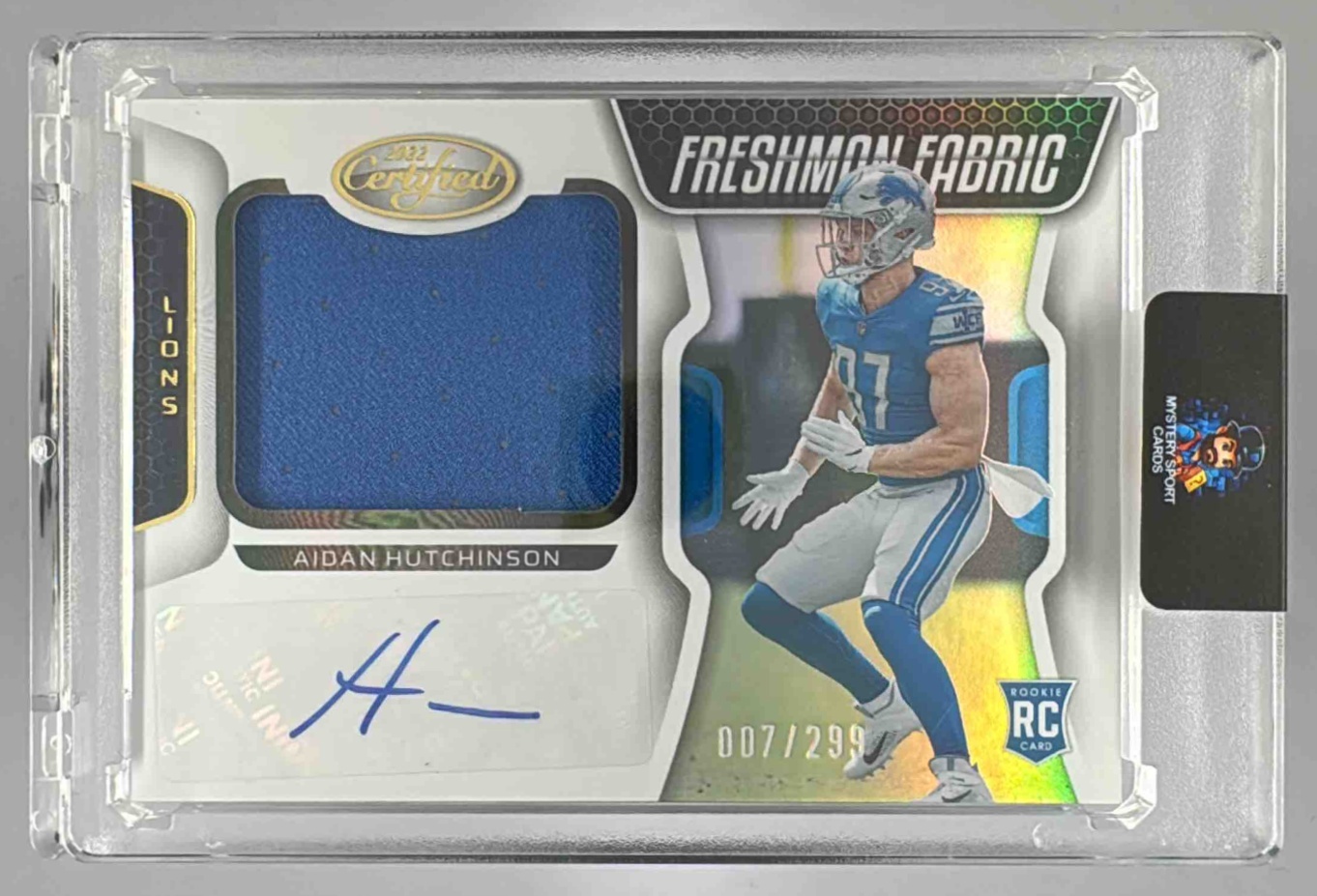 Card image for 2022 Panini Certified Aidan Hutchinson /299 #220 MEM Auto RC Fabric Lions