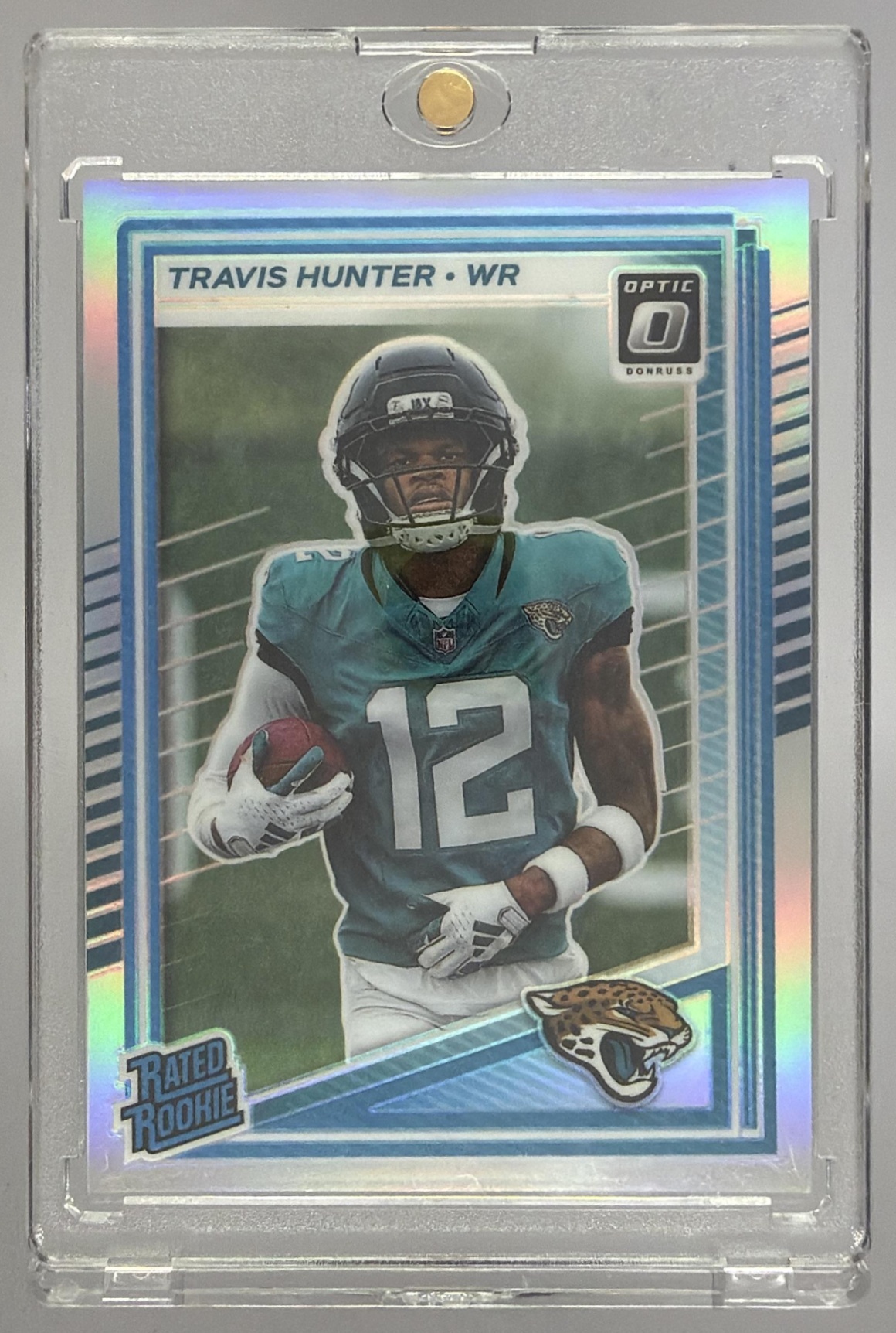 Card image for 2025 Panini Donruss Optic Travis Hunter Rated Rookie Green Hyper Prizm #201 Jaguars