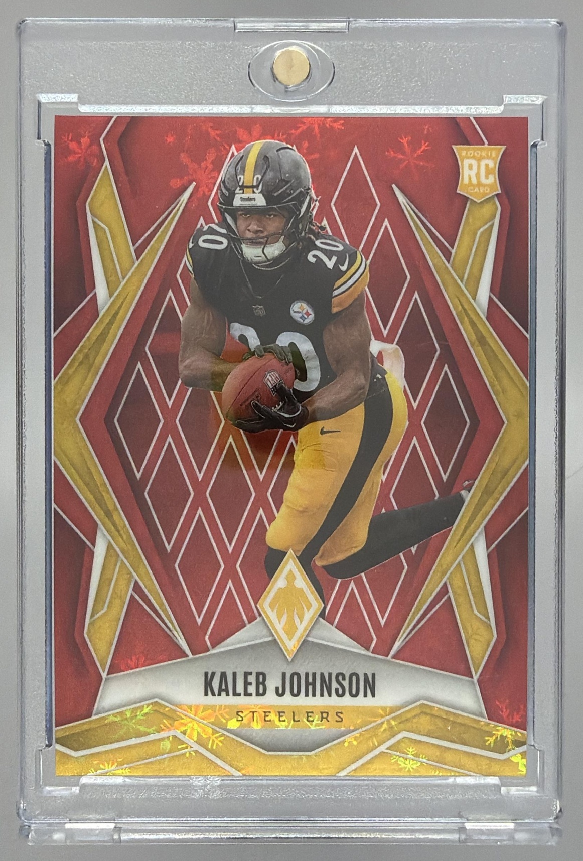 Card image for 2025 Panini Phoenix Kaleb Johnson Red Winter Prizm /399 #182 RC Steelers