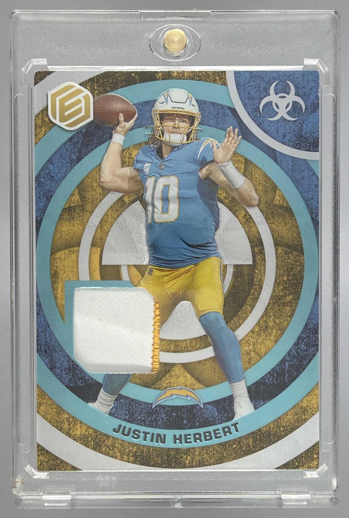 Card image for 2022 Panini Elements Justin Herbert Fusion Swatches Blue /47 #FS-17 MEM Chargers