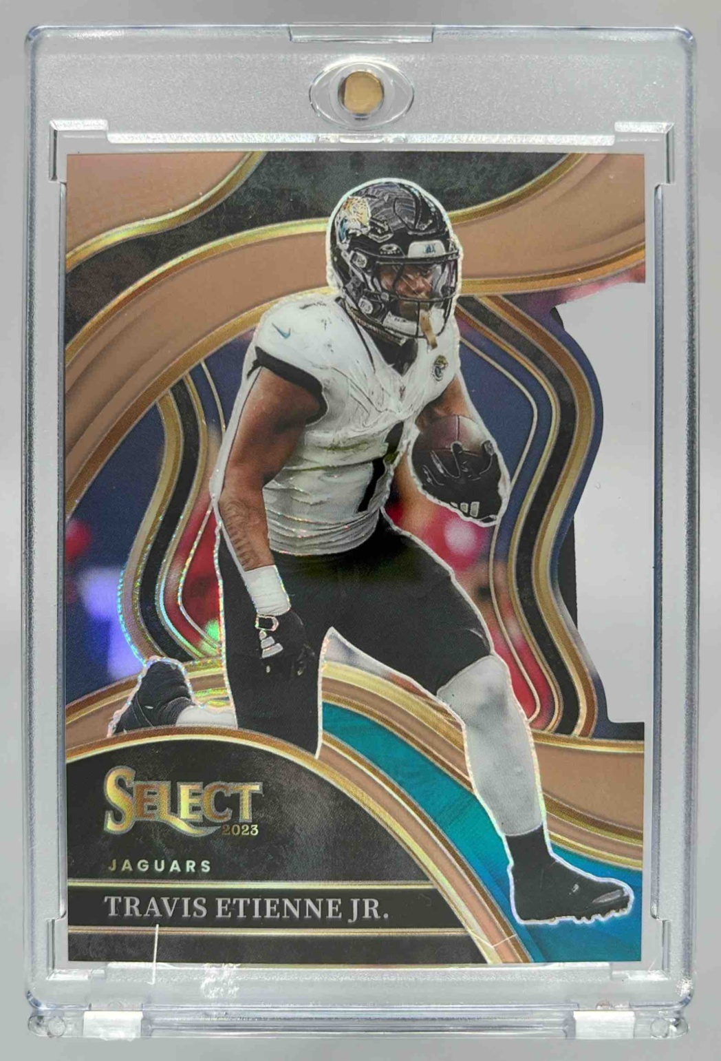 Card image for 2023 Panini Select Travis Etienne Jr. Copper Prizms Die Cut /299 #216 Club Jaguars