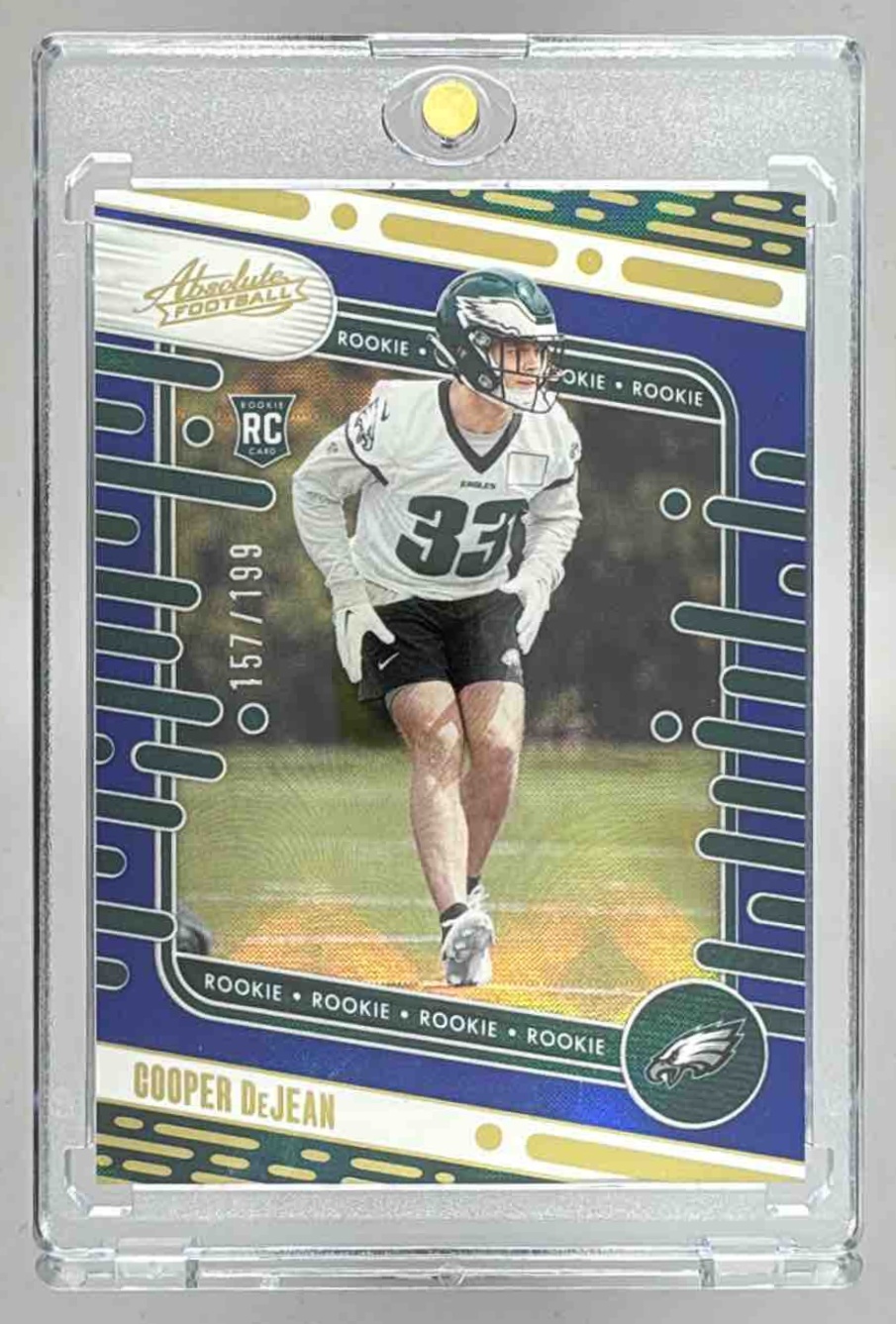 Card image for 2024 Panini Absolute Cooper DeJean Rookies Blue Diamonds /199 #140 RC Eagles