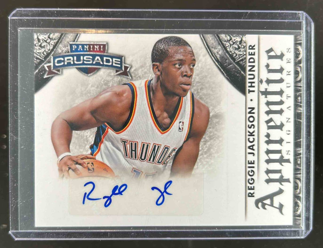 Card image for 2013-14 Panini Crusade Reggie Jackson Apprentice Signatures #38 Auto