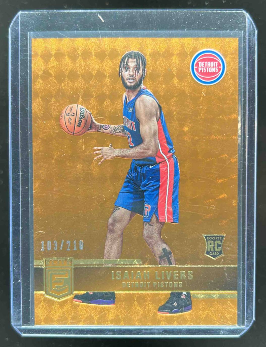 Card image for 2021-22 PANINI DONRUSS ELITE ISAIAH LIVERS ORANGE /210 #217 RC DETROIT PISTONS