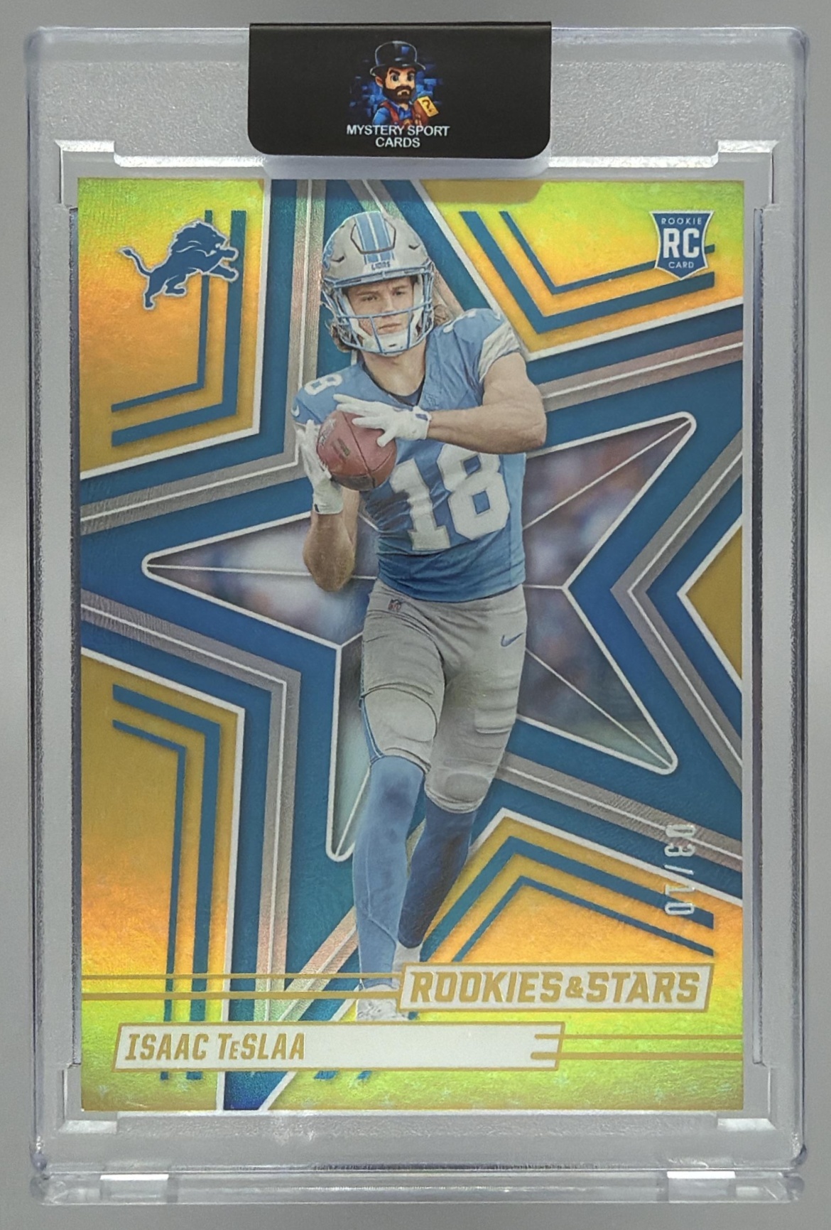 Card image for 2025 Panini Football Rookies & Stars Isaac TeSlaa Gold /10 #127 RC Detroit Lions