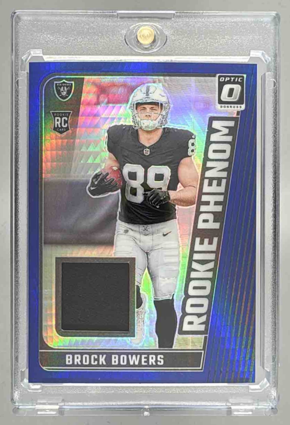Card image for 2024 Panini Donruss Optic Brock Bowers Rookie Phenoms Blue Hyper #RPB-BBS MEM RC Raiders
