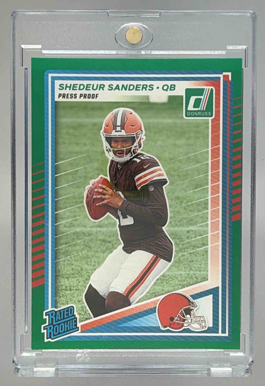 Card image for 2025 Panini Donruss Shedeur Sanders Rated Rookie Press Proof Green #306 RC Browns