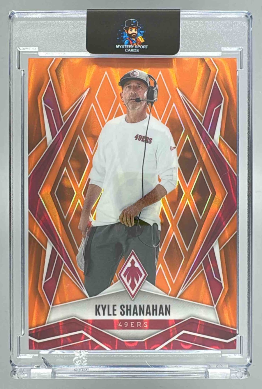 Card image for 2025 Panini Phoenix Kyle Shanahan Orange Seismic /20 #120 49ers