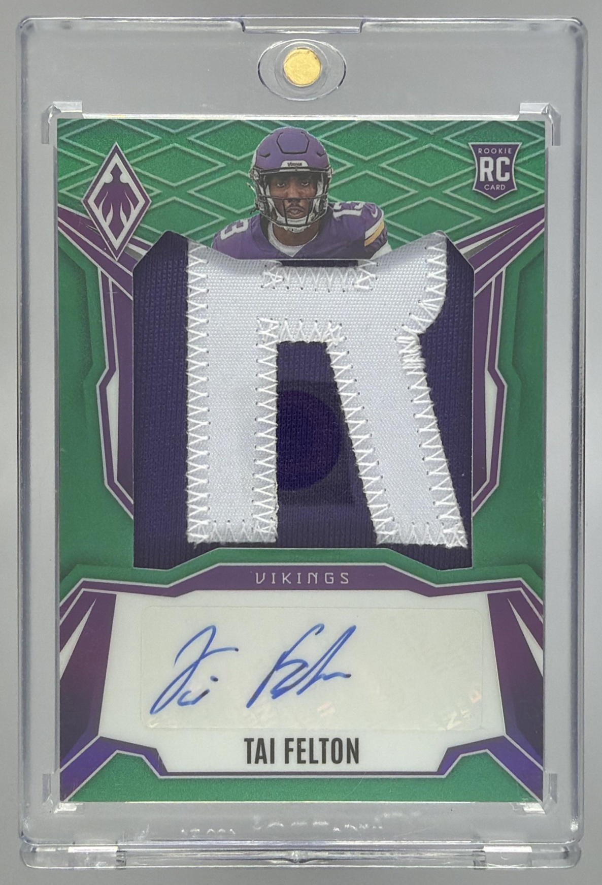 Card image for 2025 Panini Phoenix Tai Felton RPS Rookie Patch Auto ColorBurst Prizm /25 #RPS-TAF MEM RC Vikings