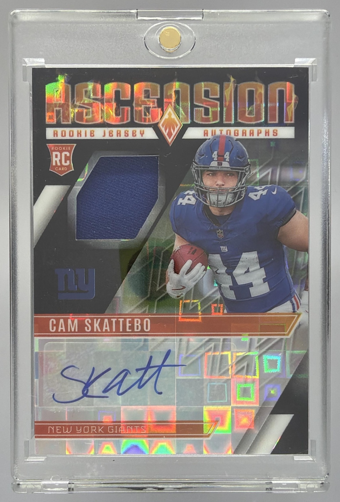 Card image for 2025 Panini Phoenix Cam Skattebo Ascension Rookie Jersey Auto Bronze Pandora /99 #ARJ-CSO MEM RC Giants