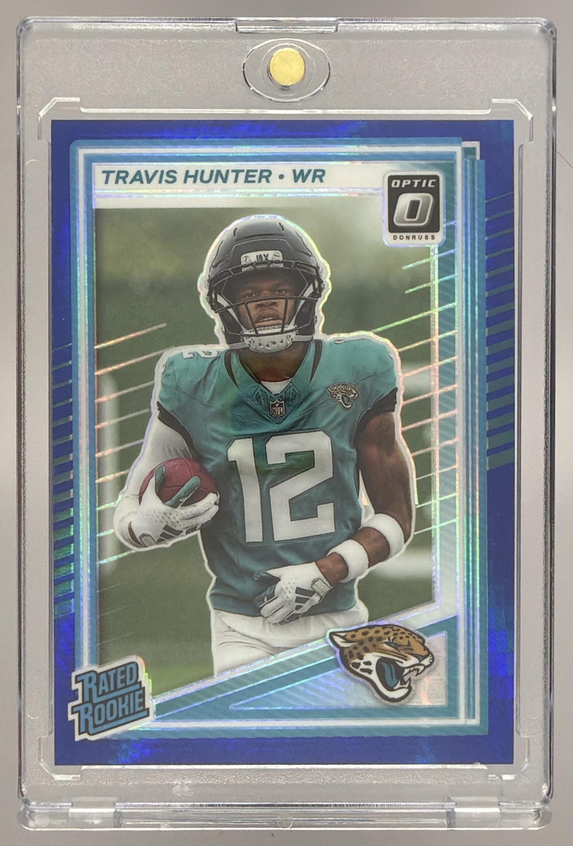 Card image for 2025 Panini Donruss Optic Travis Hunter Rated Rookie Green Hyper Prizm #201 Jaguars