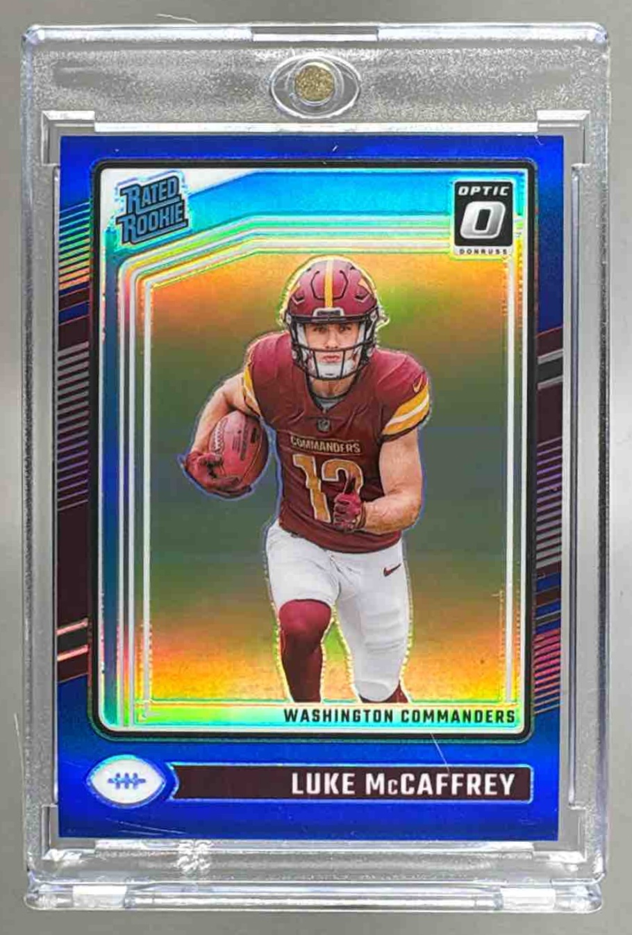 Card image for 2024 Panini Donruss Optic Luke McCaffrey Blue /199 #268 Rated Rookie Commanders