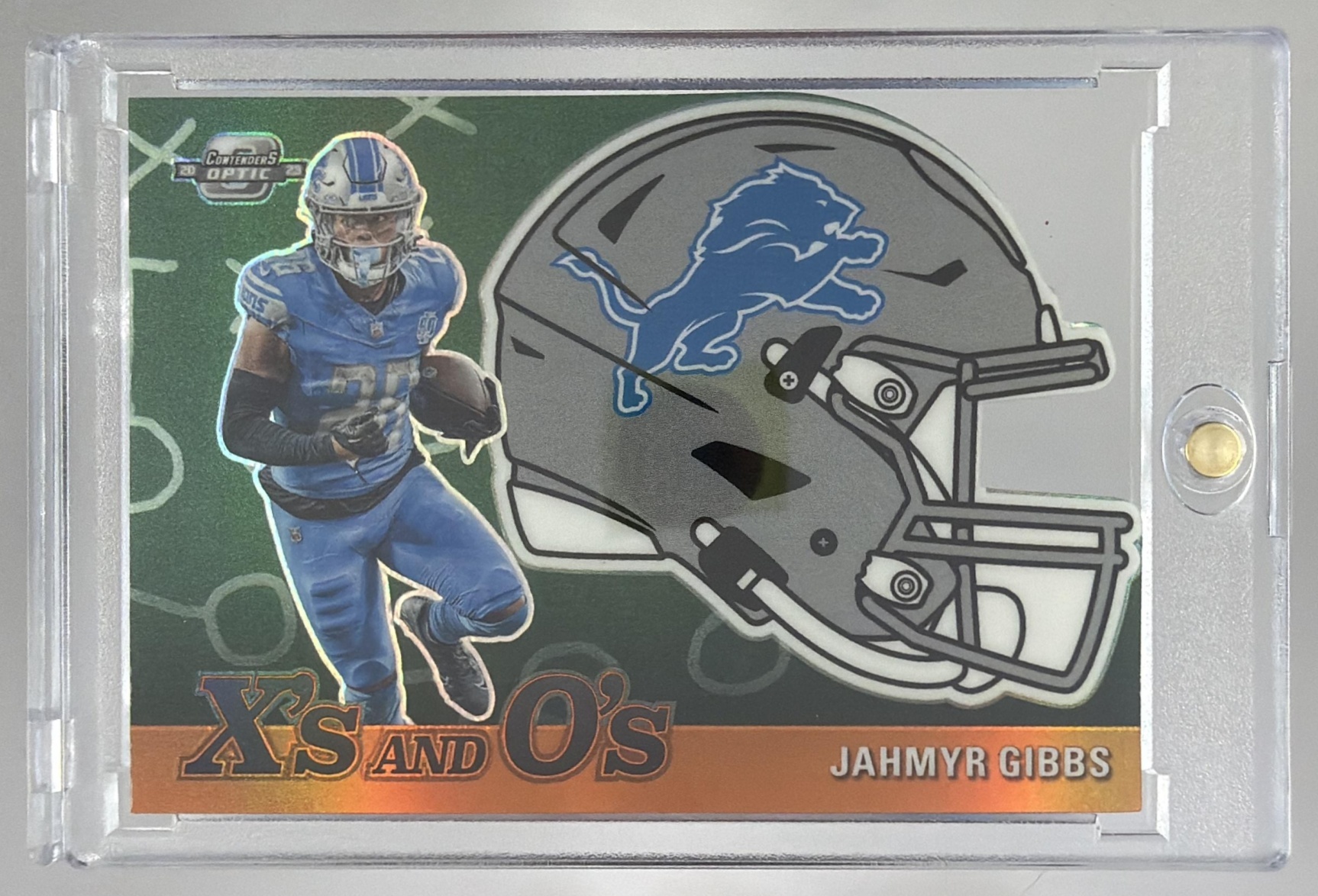 Card image for 2023 Panini Contenders Optic Jahmyr Gibbs X's and O's Orange Die Cut /50 #XO-52 RC Lions