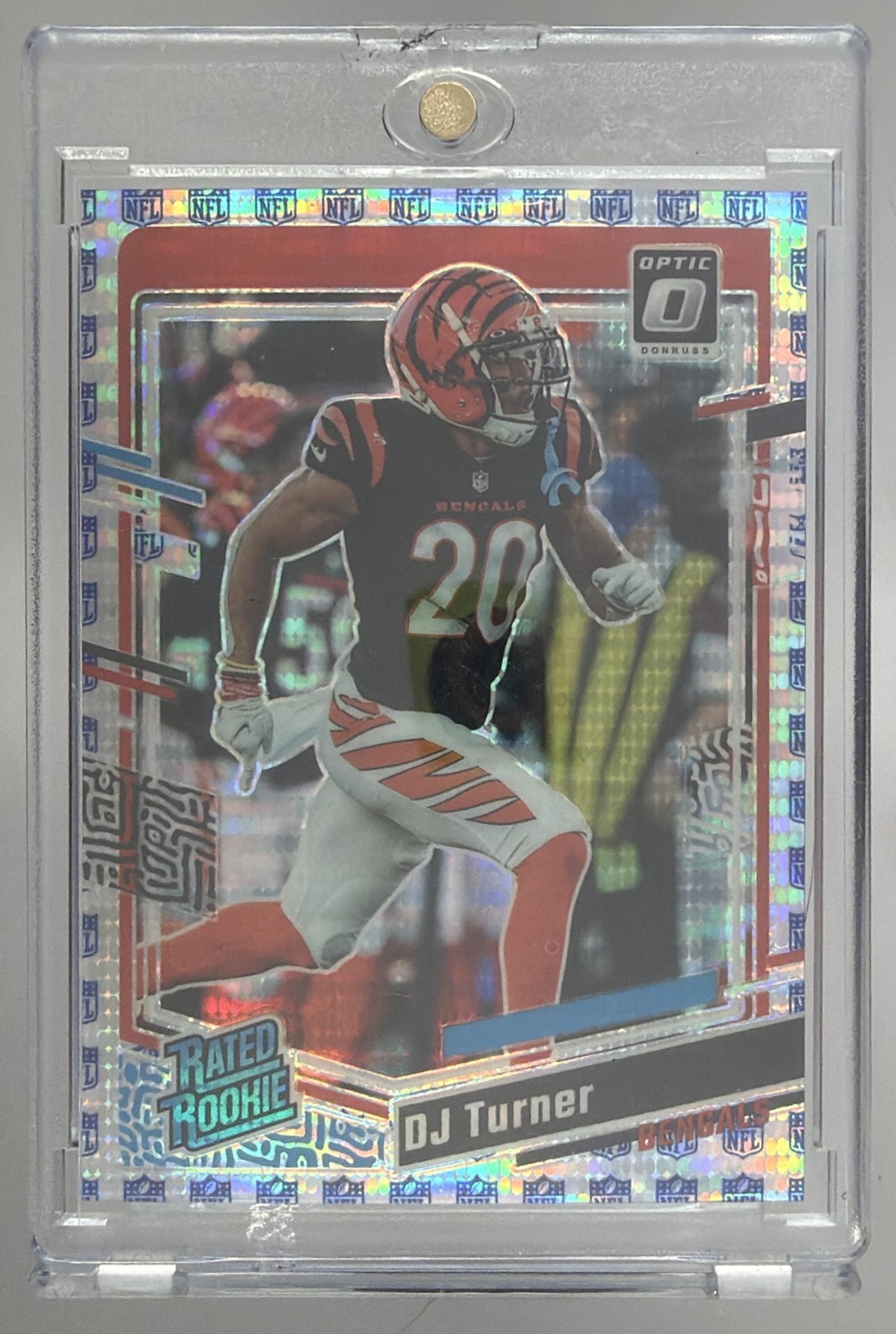 Card image for 2023 Panini Donruss Optic DJ Turner Shield Prizm /32 #220 RC Rated Rookie Bengals