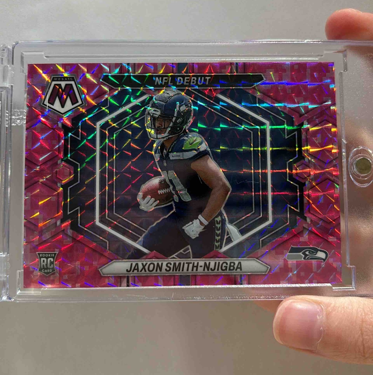Card image for 2023 Panini Mosaic Jaxon Smith-Njigba Camo Pink #ND-12 RC NFL Debut Seahawks