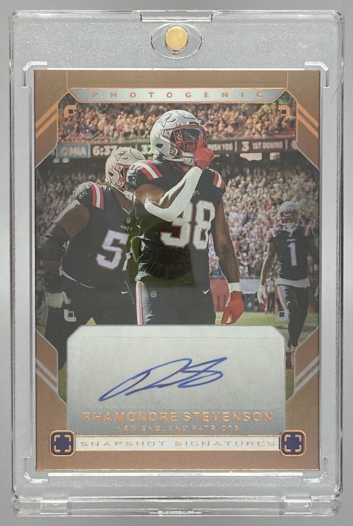 Card image for 2025 Panini PhotoGenic Rhamondre Stevenson Snapshot Signatures Bronze #23 Auto Patriots