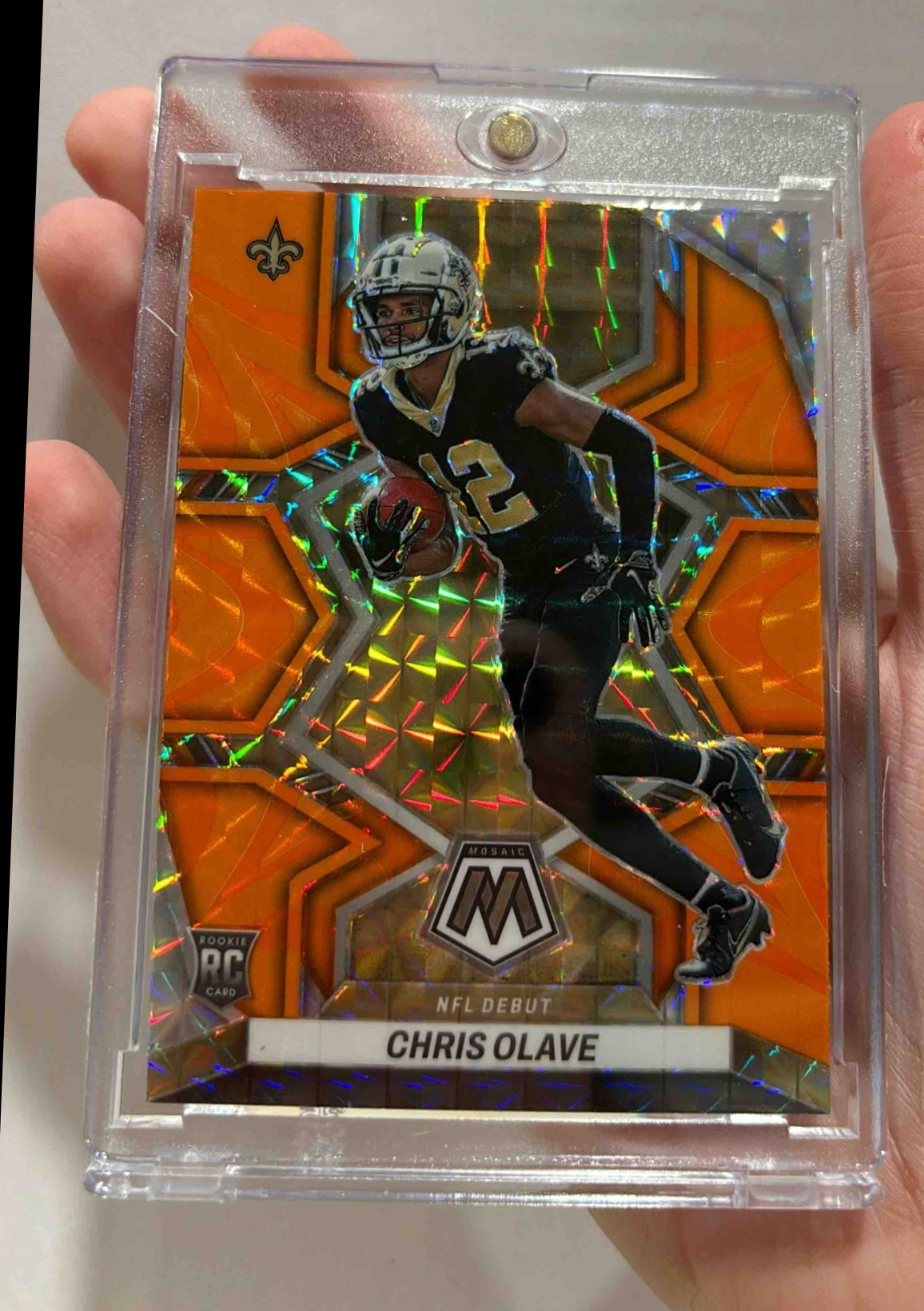 Card image for 2022 Panini Mosaic Chris Olave Reactive Orange #277 RC NFL Debut Saints