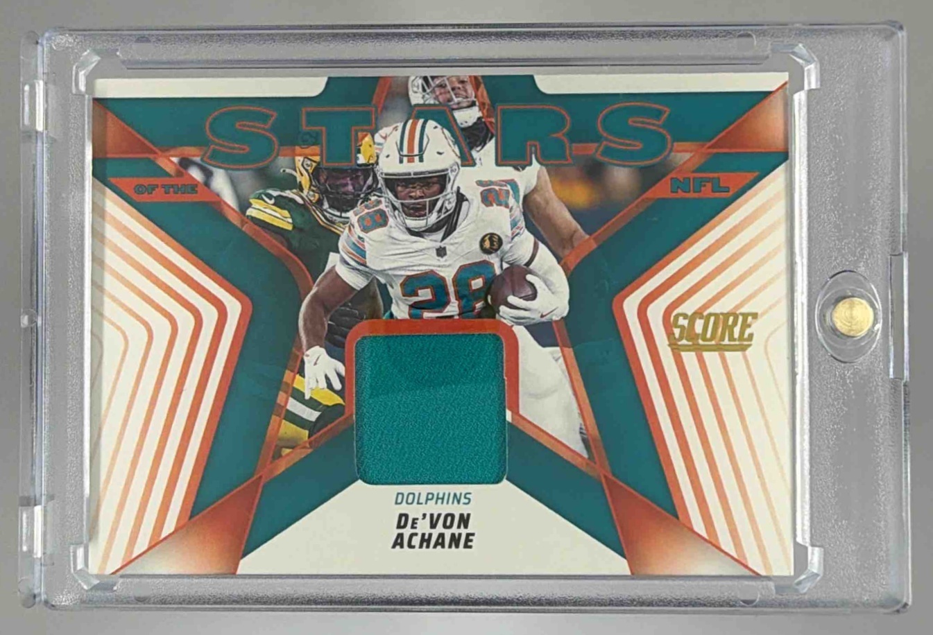 Card image for 2025 Panini Score De'Von Achane Stars of the NFL Jersey #SNJ-DAE MEM Dolphins