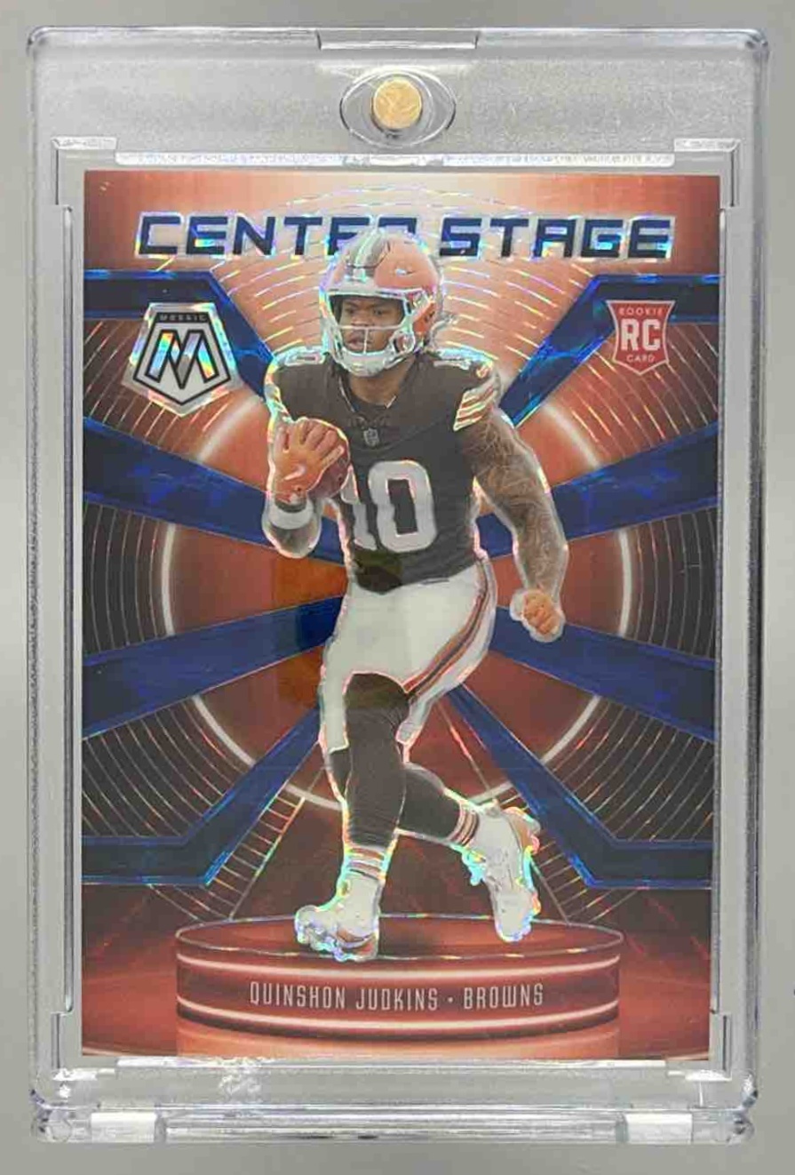 Card image for 2025 Panini Mosaic Quinshon Judkins Center Stage Blue Prizm /99 #16 RC Browns