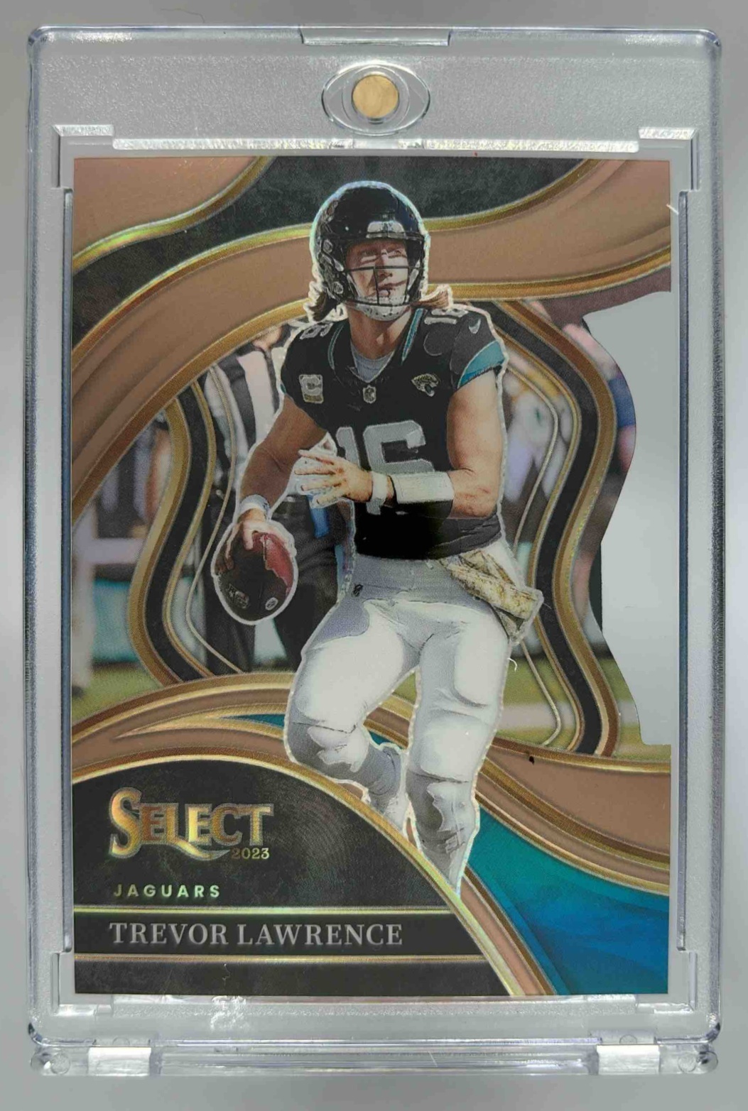 Card image for 2023 Panini Select Trevor Lawrence Copper Prizms Die Cut /299 #212 Club Jaguars