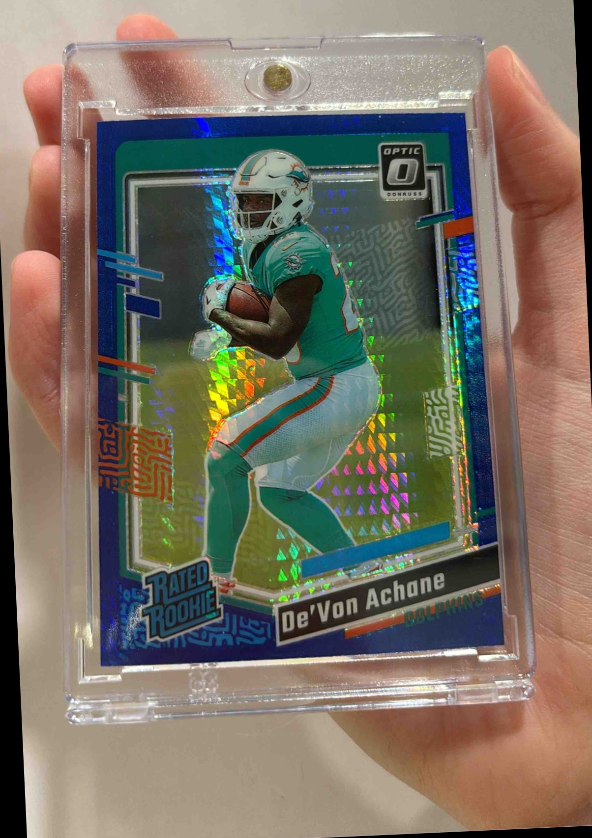 Card image for 2023 Panini Donruss Optic De'Von Achane Blue Hyper Prizm #269 RC Rated Rookie Dolphins