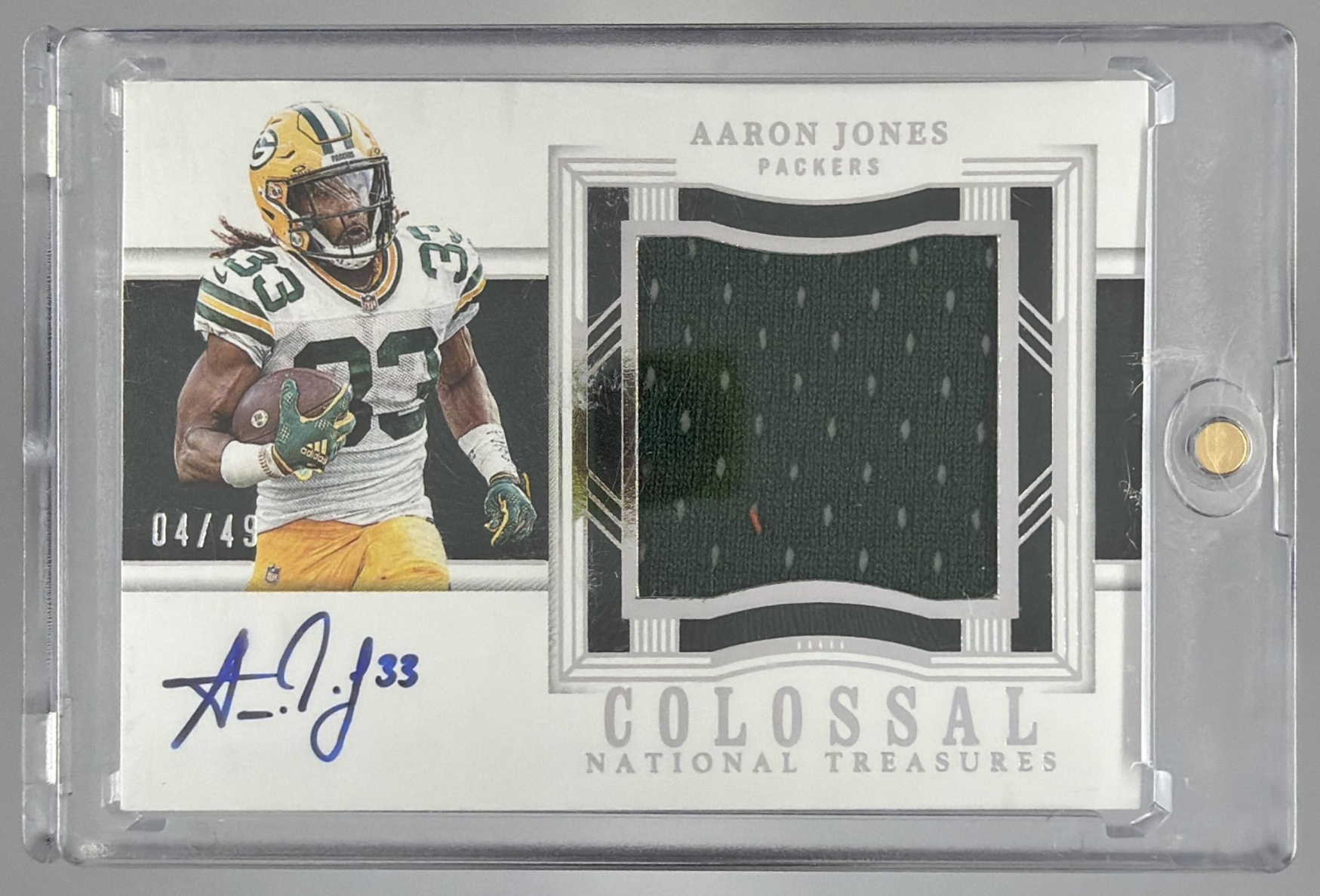 Card image for 2024 Panini National Treasures Aaron Jones Framed Fabric /49 #FF-AJS MEM Vikings