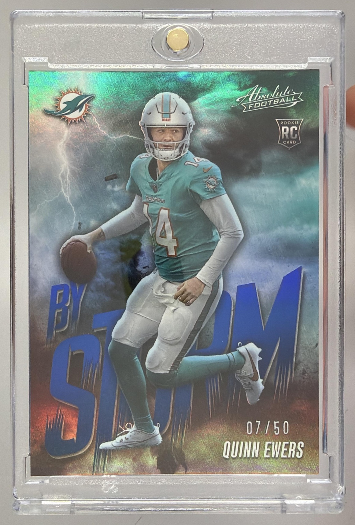 Card image for 2025 Panini Absolute Quinn Ewers By Storm Spectrum Blue /50 #13 RC Dolphins