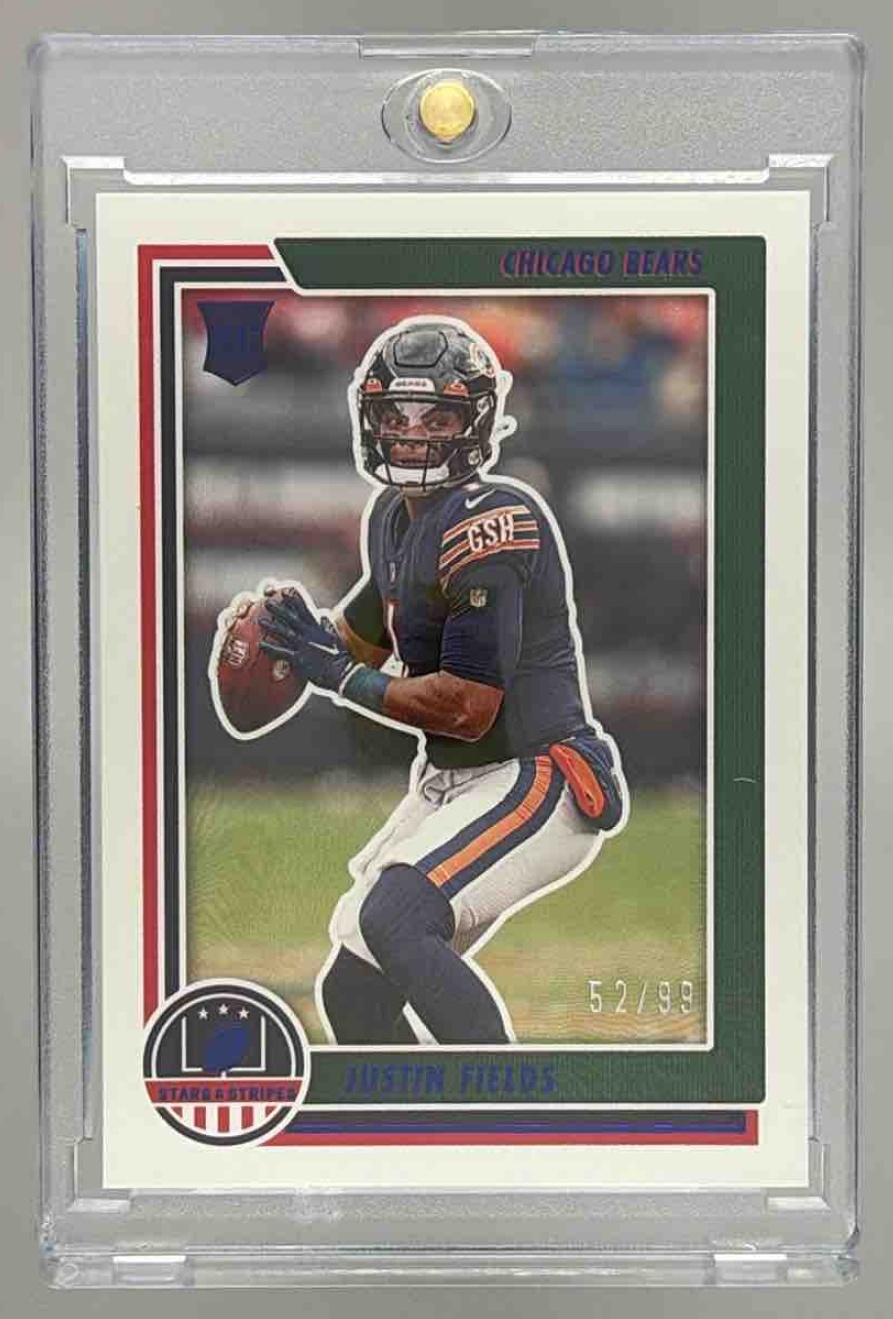 Card image for 2021 Panini Chronicles Justin Fields Stars and Stripes Blue /99 #STS-JFI RC Bears