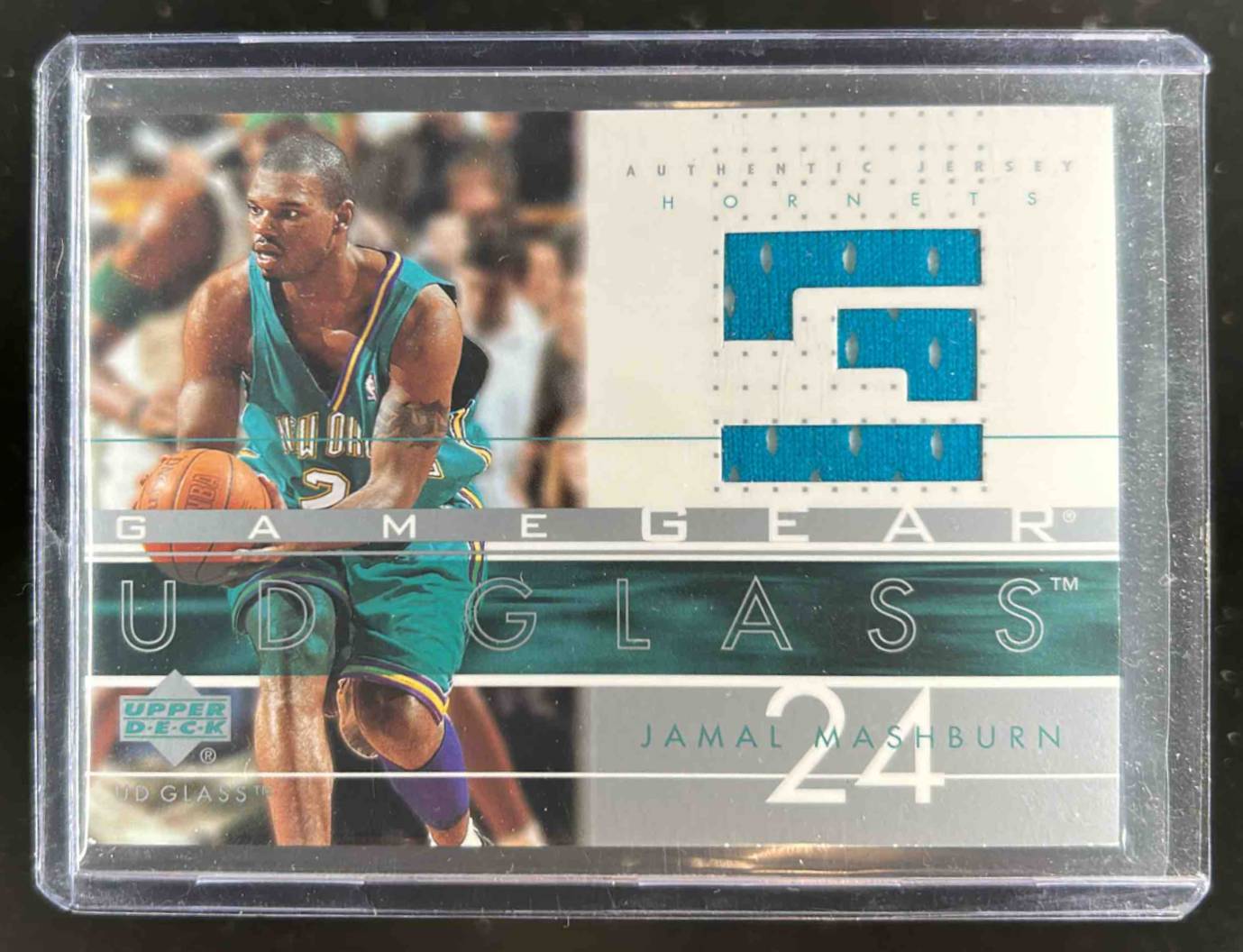 Card image for 2002-03 UPPER DECK GLASS JAMAL MASHBURN GAME GEAR #JM-GG