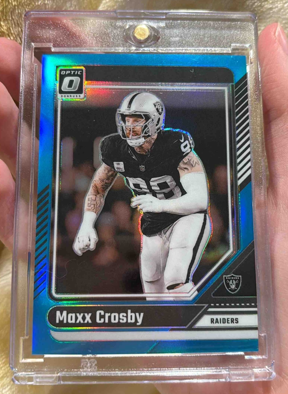 Card image for 2024 Panini Football Donruss Optic Maxx Crosby Aqua /299 #105 Las Vegas Raiders