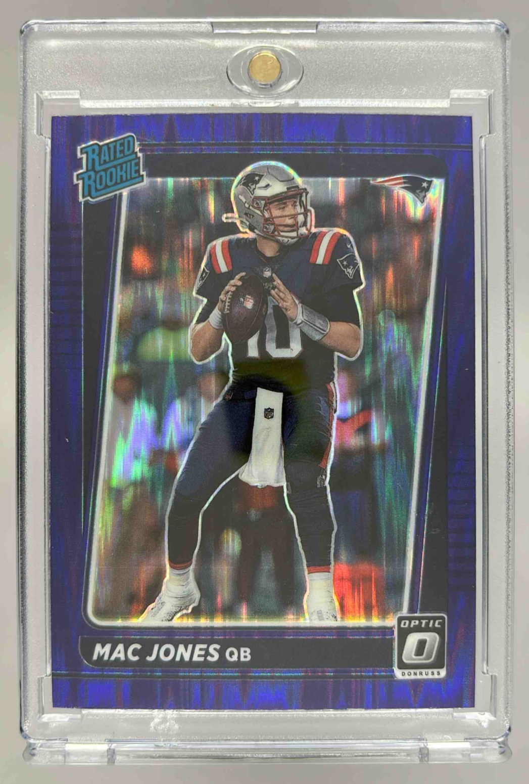 Card image for 2021 Panini Donruss Optic Mac Jones Purple Shock #206 RC Rated Rookie Patriots