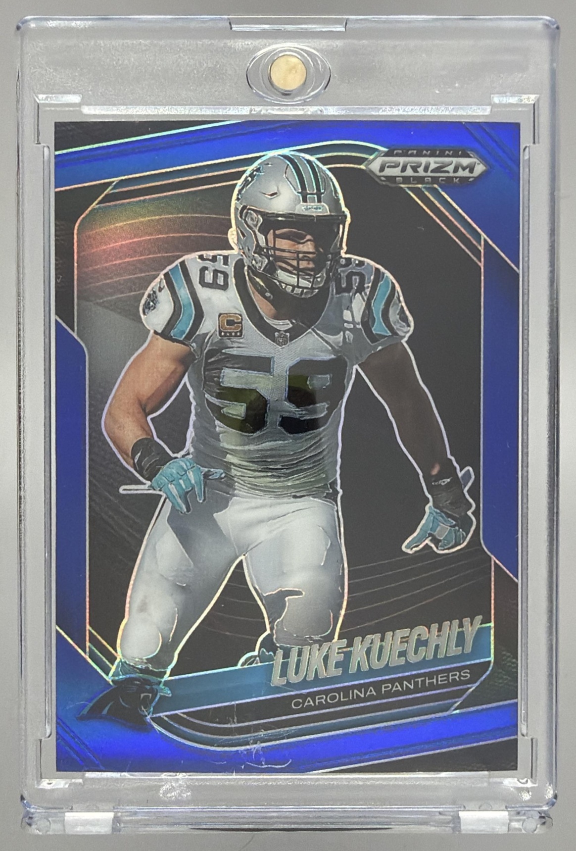 Card image for 2025 Panini Football Prizm Black Luke Kuechly Blue /199 #18 Carolina Panthers