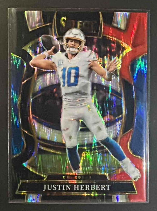 Card image for 2025 Panini Select Justin Herbert #1 Concourse Black and Red Prizm Shock